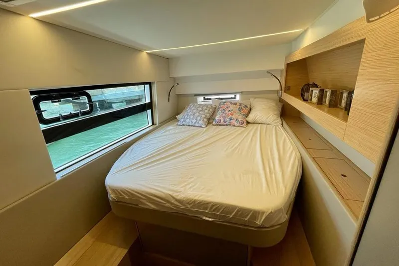 Slide: The Image of Cozy bedroom in 2019 Nautitech 47 Power yacht with modern design and window view. - 7