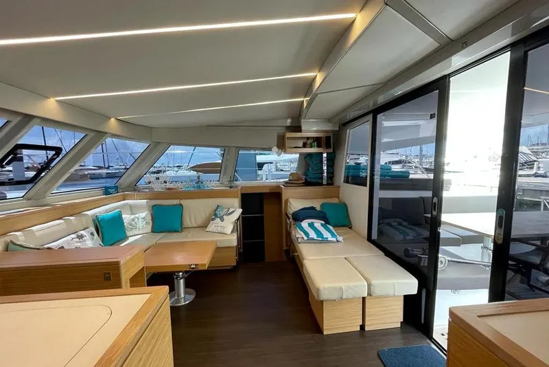 Slide: The Image of Luxurious interior of 2019 Nautitech 47 Power yacht with modern seating and panoramic windows. - 8