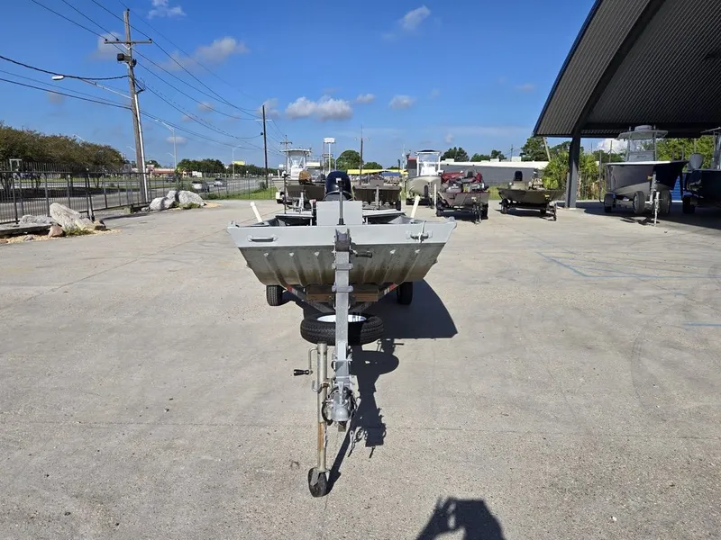 Slide: The Image of 1991 Alumaweld FLATBOAT parked on a trailer outdoors. - 4