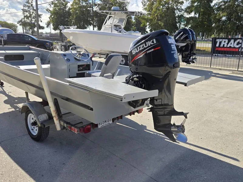 Slide: The Image of 1991 Alumaweld FLATBOAT with Suzuki outboard motor on trailer. - 5