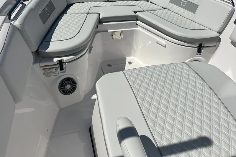 Slide: The Image of 2026 Sea Fox 268 Commander boat interior with Garmin navigation system at a marina. - 13
