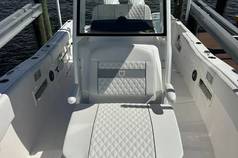 Slide: The Image of 2026 Sea Fox 268 Commander boat docked, showcasing sleek design and dual engines. - 14