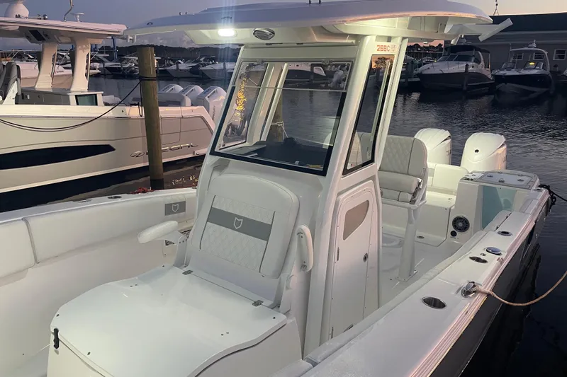 Slide: The Image of 2026 Sea Fox 268 Commander boat interior with cushioned seating and storage. - 15