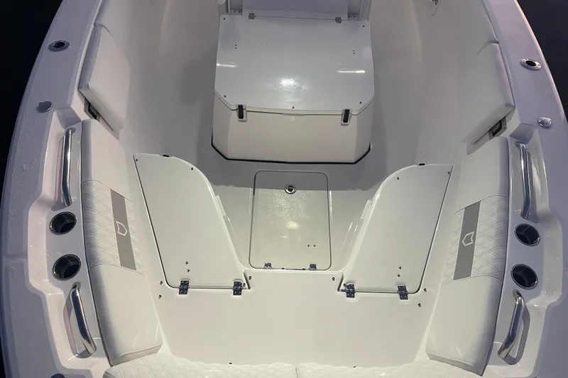 Slide: The Image of 2026 Sea Fox 268 Commander boat interior at a marina, showcasing seating and helm. - 20