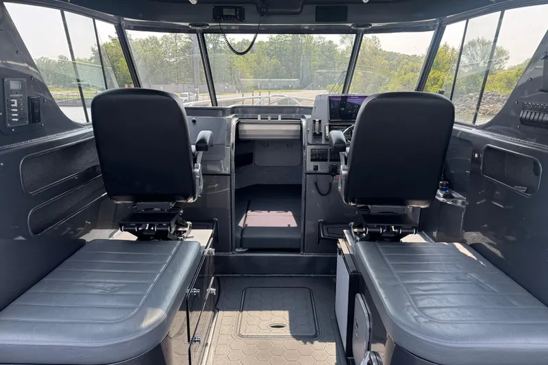Slide: The Image of Interior of 2023 Extreme Boats 795 Game King, featuring dual seats and modern controls. - 17