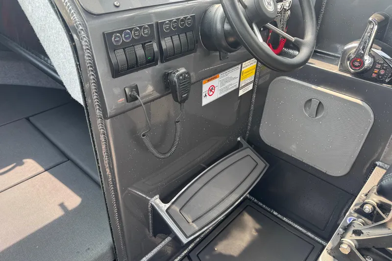 Slide: The Image of Interior of 2023 Extreme Boats 795 Game King, featuring controls and steering wheel. - 23