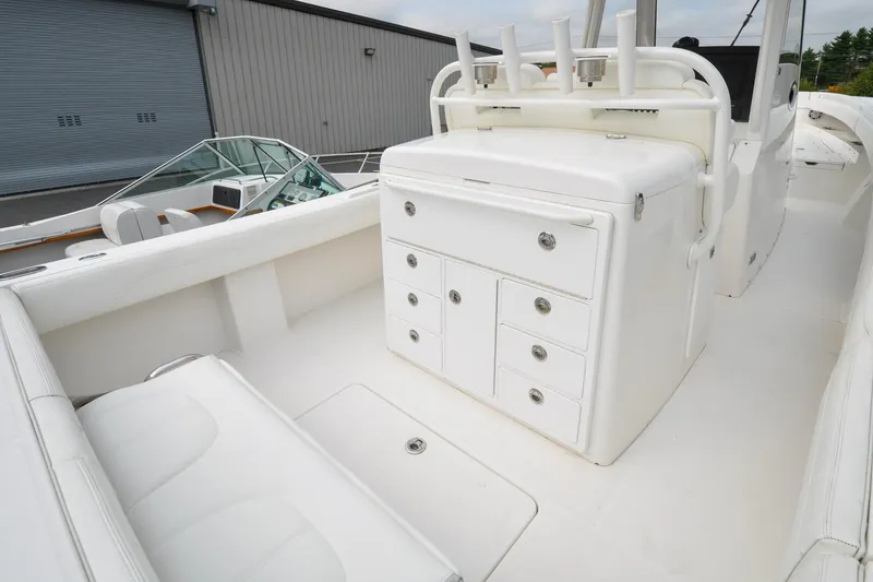 Slide: The Image of 2021 Regulator 31 boat interior with white seating and storage compartments. - 15