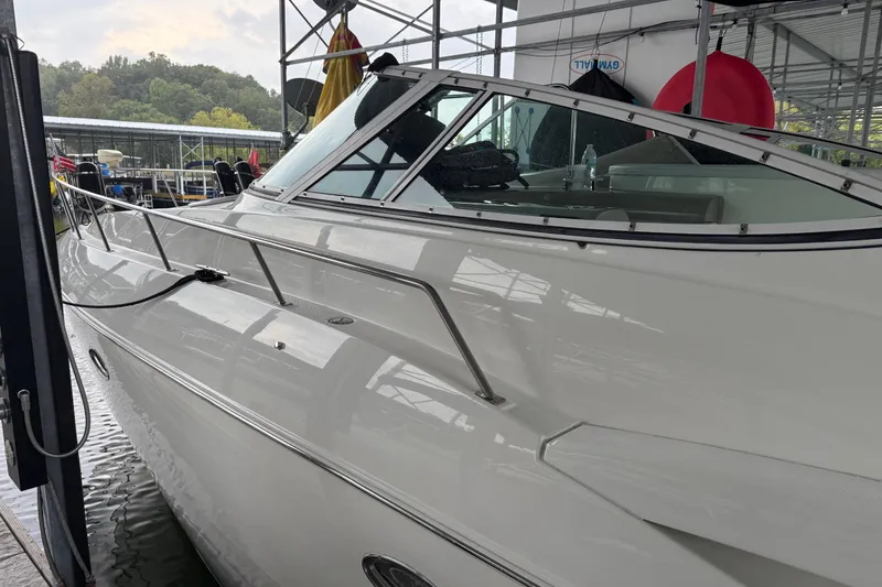 Slide: The Image of 2001 Cruisers Yachts 3672 Express docked in a marina, side view. - 14