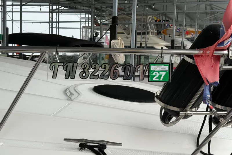 Slide: The Image of 2001 Cruisers Yachts 3672 Express with registration TN 3226 DV, docked in a marina. - 21