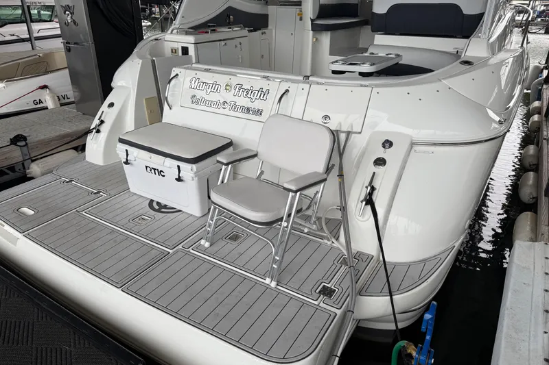 Slide: The Image of 2001 Cruisers Yachts 3672 Express with seating and cooler on deck. - 25