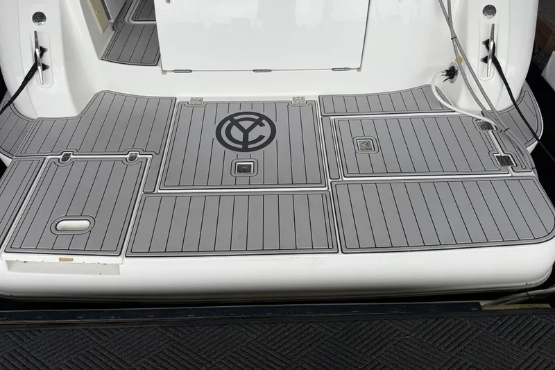 Slide: The Image of 2001 Cruisers Yachts 3672 Express swim platform with custom gray decking. - 27