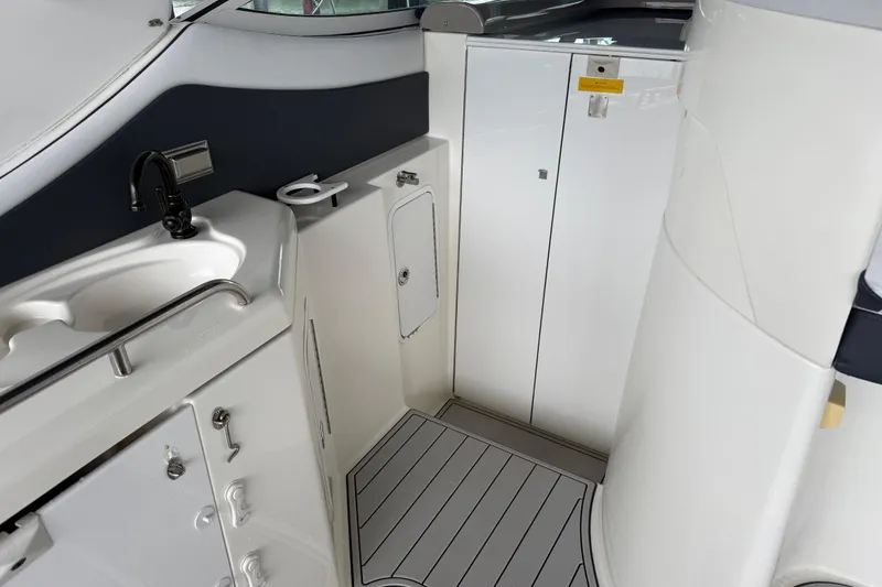 Slide: The Image of 2001 Cruisers Yachts 3672 Express interior with sink and storage cabinets. - 29