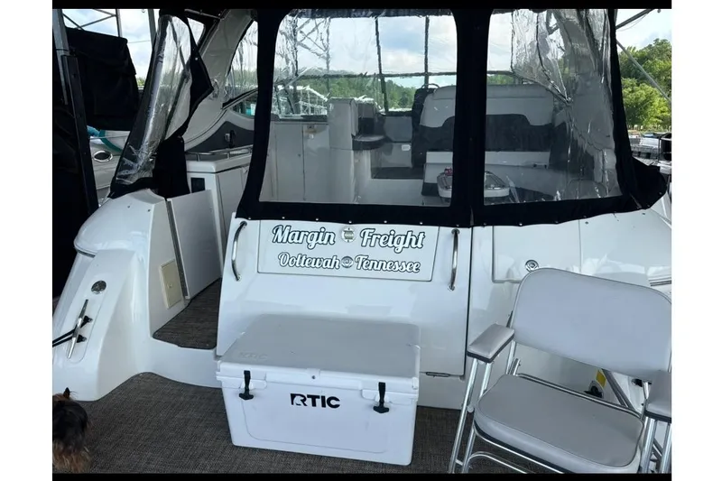 Slide: The Image of 2001 Cruisers Yachts 3672 Express boat with seating and cooler on deck. - 3