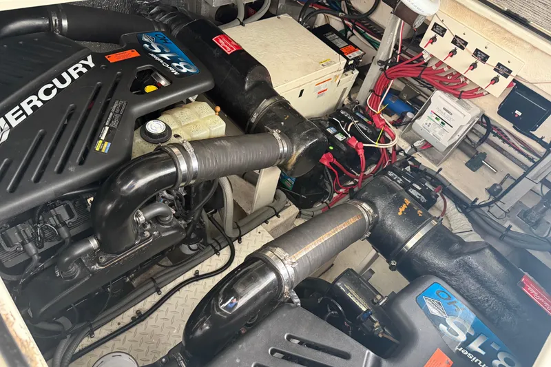 Slide: The Image of Engine room of a 2001 Cruisers Yachts 3672 Express with Mercury engines and electrical components. - 39