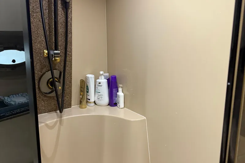 Slide: The Image of Shower area in 2001 Cruisers Yachts 3672 Express with toiletries and showerhead. - 45