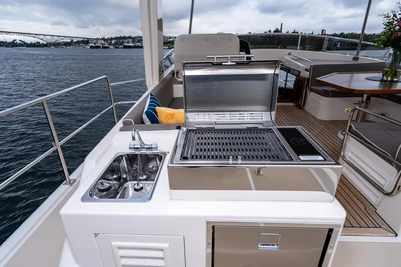 Slide: The Image of Outdoor kitchen on 2024 Fleming 58 Pilothouse yacht with grill and sink. - 12