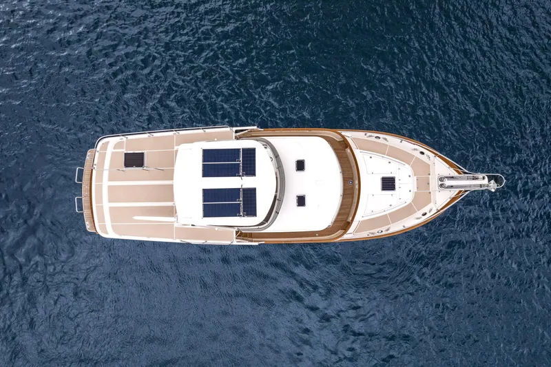 Slide: The Image of Aerial view of 2024 Fleming 58 Pilothouse yacht on open water. - 5