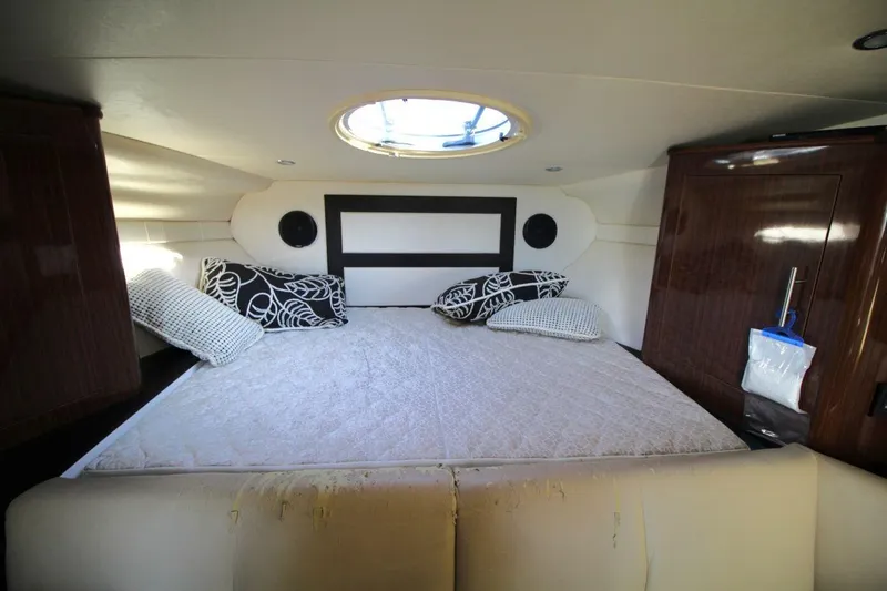 Slide: The Image of Interior cabin of 2015 Regal 32 Express yacht with bed and pillows. - 18