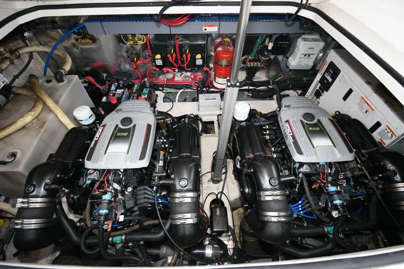 Slide: The Image of Engine compartment of a 2015 Regal 32 Express boat with dual engines. - 22
