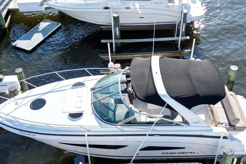 Slide: The Image of 2015 Regal 32 Express boat docked at marina, aerial view. - 5