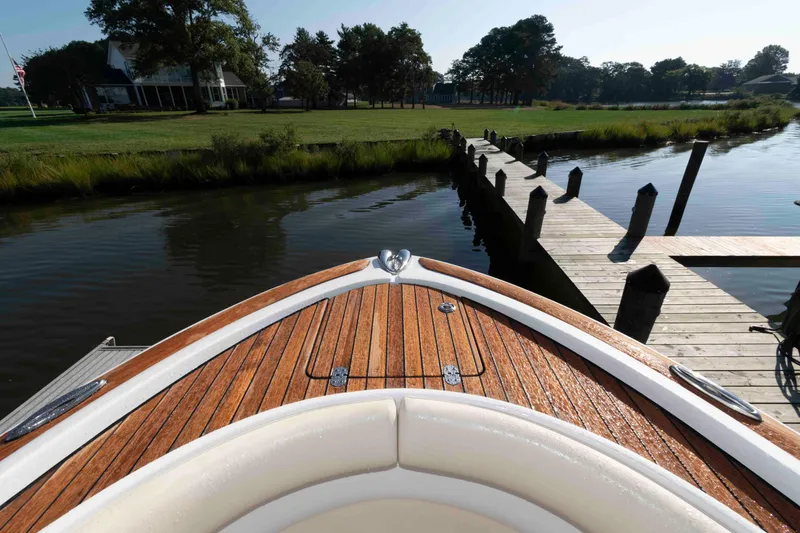 Slide: The Image of Bow of 2013 Chris-Craft Catalina 26 at dock, with scenic waterfront view. - 14