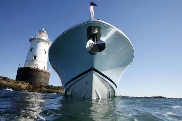 Slide: The Image of 2013 Chris-Craft Catalina 26 boat docked by a scenic waterfront. - 4
