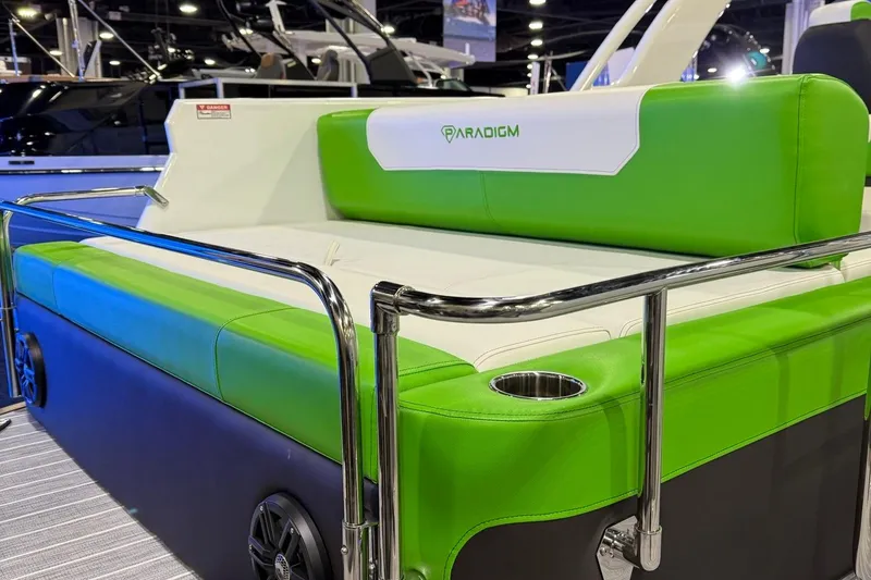 Slide: The Image of 2025 Paradigm 25SS boat with vibrant green seating and sleek design. - 10