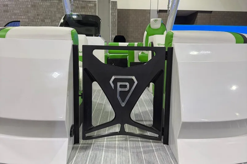 Slide: The Image of 2025 Paradigm 25SS boat interior with green and white seating, featuring a stylish gate. - 12