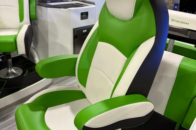Slide: The Image of Green and white Paradigm 25SS 2025 boat seat with modern design and armrests. - 13