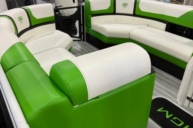 Slide: The Image of Luxurious green and white seating in 2025 Paradigm 25SS boat interior. - 15