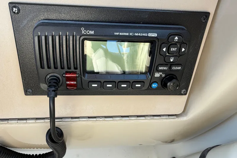 Slide: The Image of Icom VHF marine radio on 2001 Sea Ray 260 Sundancer boat dashboard. - 12