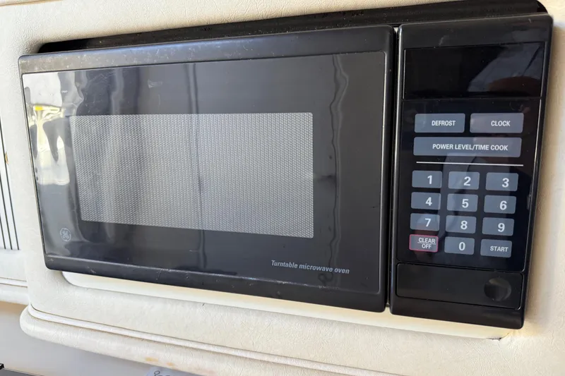 Slide: The Image of Built-in GE microwave in 2001 Sea Ray 260 Sundancer boat kitchen area. - 20