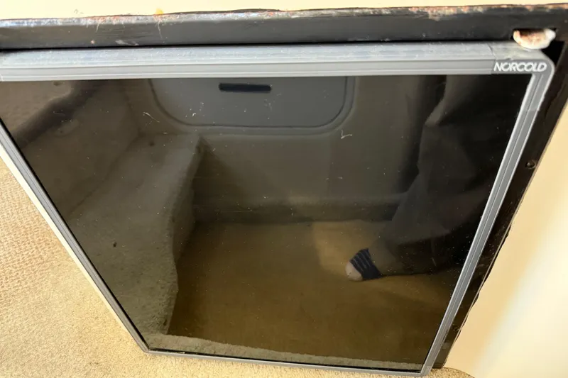 Slide: The Image of Norcold refrigerator in a 2001 Sea Ray 260 Sundancer boat interior. - 21