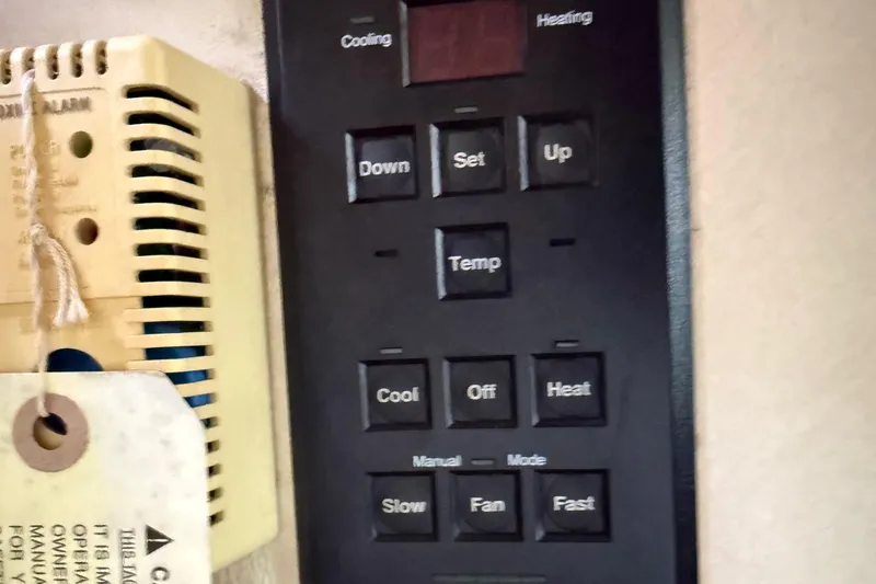 Slide: The Image of Control panel with temperature settings on a 2001 Sea Ray 260 Sundancer boat. - 24