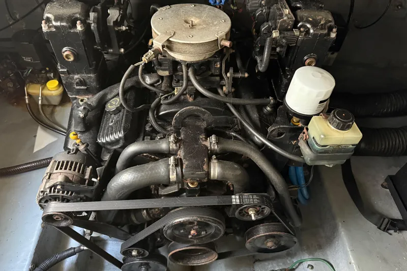 Slide: The Image of Engine of a 2001 Sea Ray 260 Sundancer boat, showing belts and components. - 34