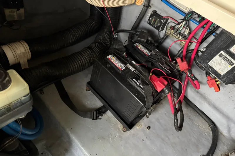 Slide: The Image of Battery compartment of a 2001 Sea Ray 260 Sundancer boat with wiring and components. - 35