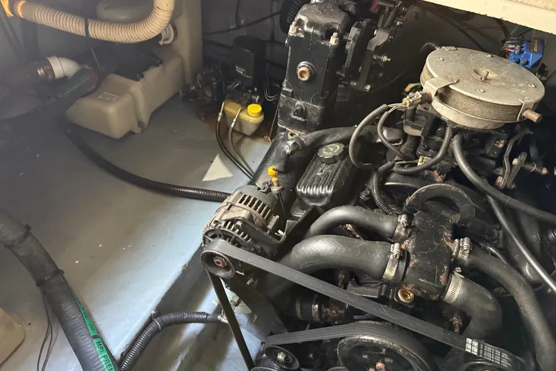 Slide: The Image of Engine compartment of a 2001 Sea Ray 260 Sundancer boat, showing mechanical components. - 37