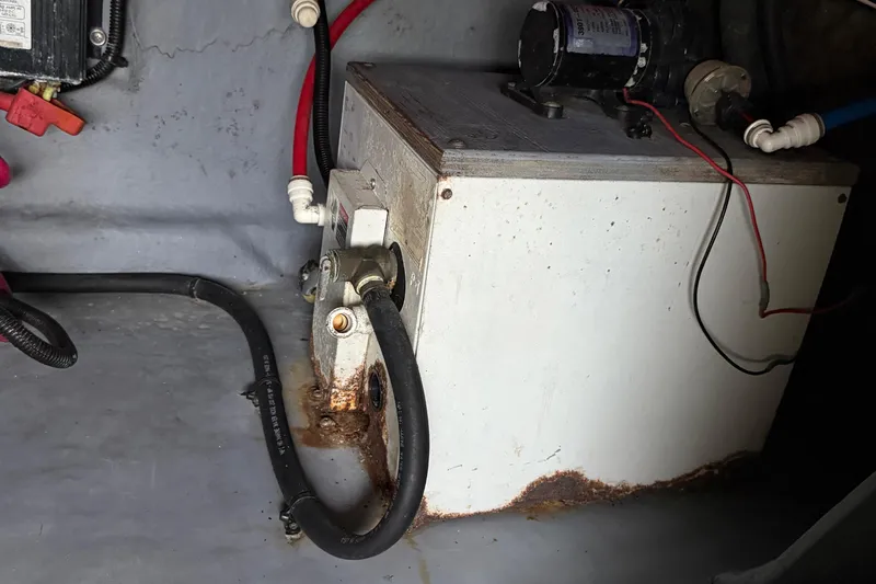 Slide: The Image of Engine compartment of a 2001 Sea Ray 260 Sundancer with visible wiring and components. - 41