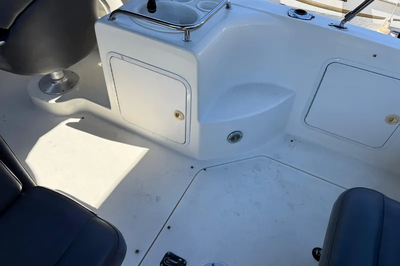 Slide: The Image of Interior view of a 2001 Sea Ray 260 Sundancer boat cockpit area. - 8