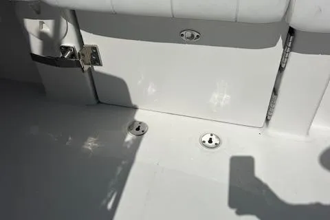 Slide: The Image of 2017 Regulator 31 boat interior with white seating and hardware details. - 16