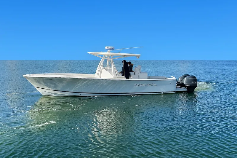 Slide: The Image of 2017 Regulator 31 boat on calm blue ocean waters. - 2