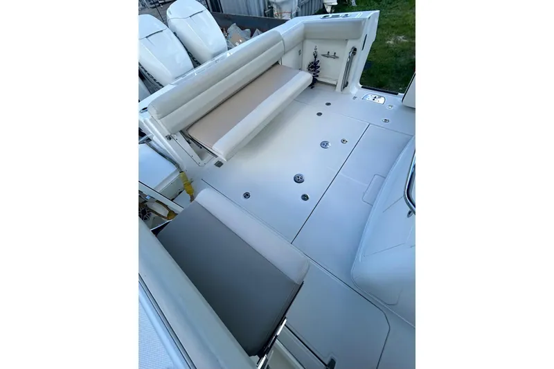 Slide: The Image of 2017 Boston Whaler 380 Outrage boat interior with seating and deck view. - 3