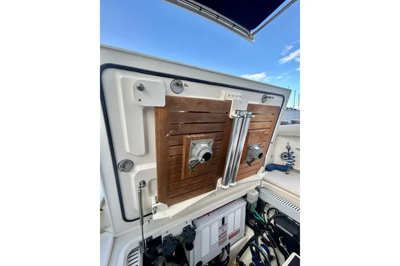 Slide: The Image of 2017 Boston Whaler 380 Outrage boat interior, featuring storage compartments and equipment. - 5