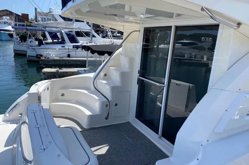 Slide: The Image of 2007 Sea Ray 36 Sedan Bridge yacht with spacious deck and marina view. - 12
