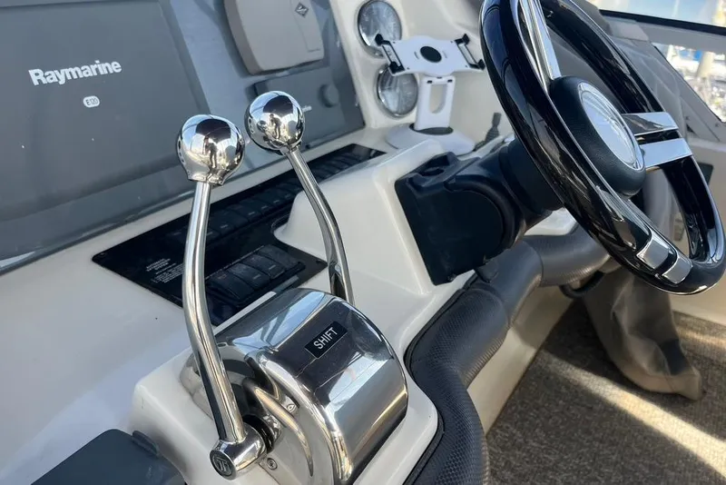 Slide: The Image of 2007 Sea Ray 36 Sedan Bridge helm with Raymarine electronics and dual throttle controls. - 15