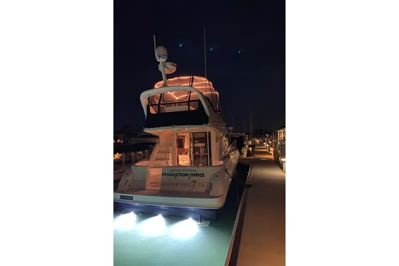 Slide: The Image of 2007 Sea Ray 36 Sedan Bridge yacht docked at night, Newport Beach. - 20