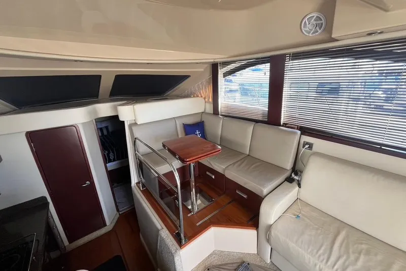 Slide: The Image of Luxurious interior of 2007 Sea Ray 36 Sedan Bridge yacht with cream leather seating. - 23