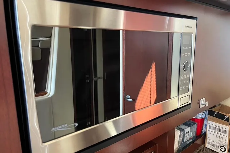 Slide: The Image of Stainless steel microwave in 2007 Sea Ray 36 Sedan Bridge yacht interior. - 26