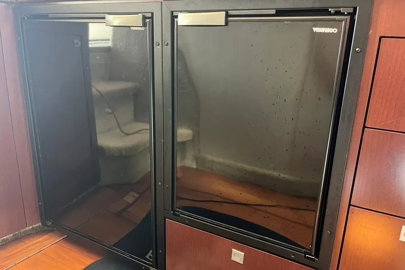 Slide: The Image of Built-in fridge on 2007 Sea Ray 36 Sedan Bridge yacht interior. - 28