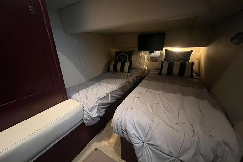 Slide: The Image of Twin beds in a cozy cabin of a 2007 Sea Ray 36 Sedan Bridge yacht. - 31